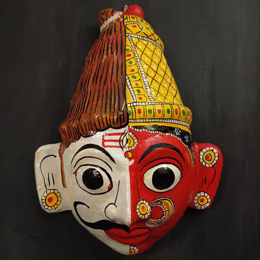ardhanareshwara cheriyal mask in white and red color combination represents lord shiva and parvati devi