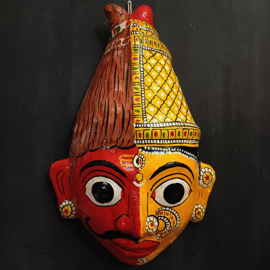 ardhanareshwara cheriyal mask in red and yellow color combination represents lord shiva and parvati devi