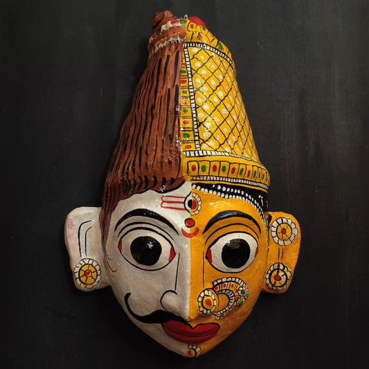 ardhanareshwara cheriyal mask in white and yellow color combination represents lord shiva and parvati devi