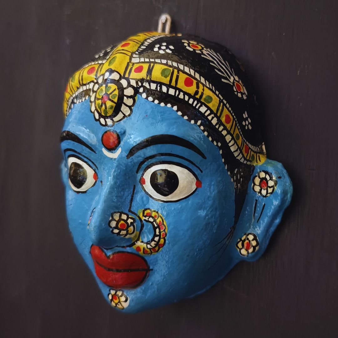 classic female cheriyal mask with blue color face wearing ornaments