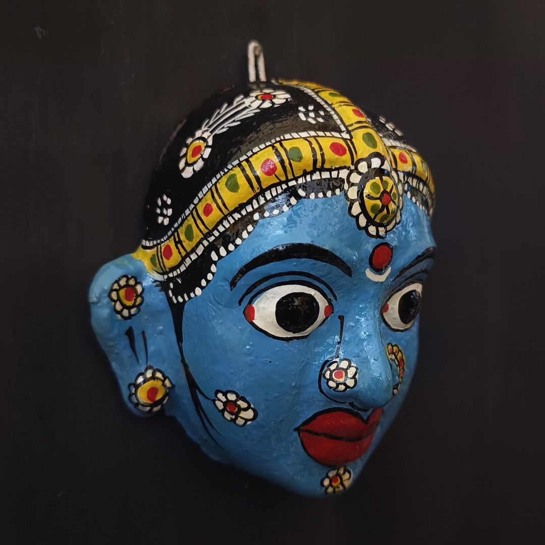 classic female cheriyal mask with blue color face wearing ornaments