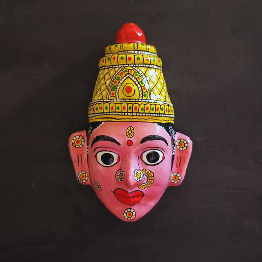 crowned female cheriyal mask in dark pink face color with traditional and vintage look