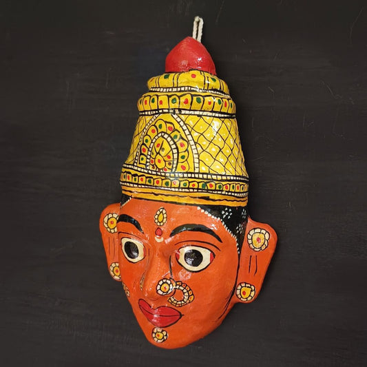 crowned female cheriyal mask in orange color face traditional and vintage look