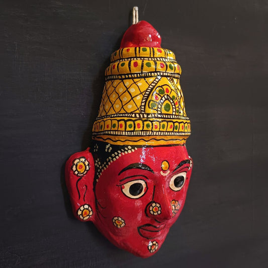 crowned female cheriyal mask in red color face with traditional and vintage look