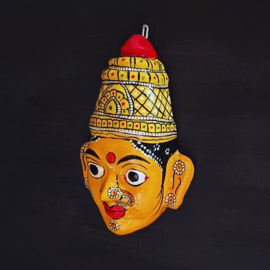 crowned female cheriyal mask in yellow color face with traditional and vintage look