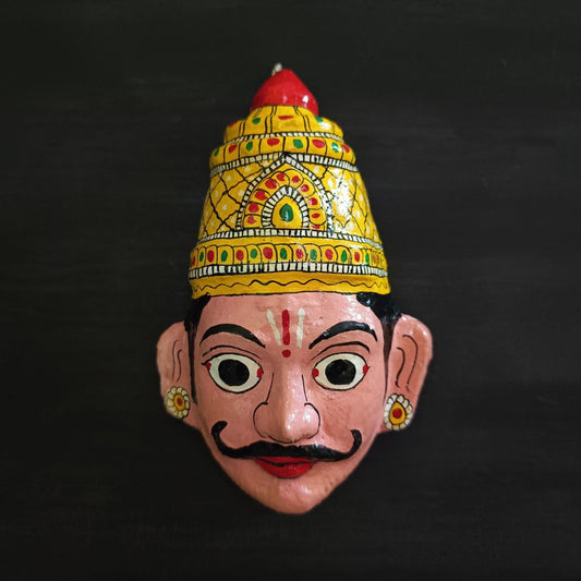 crowned male cheriyal mask in light pink face color with traditional and vintage look