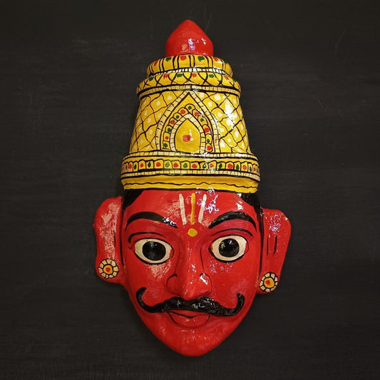 crowned male cheriyal mask in red color face with traditional and vintage look
