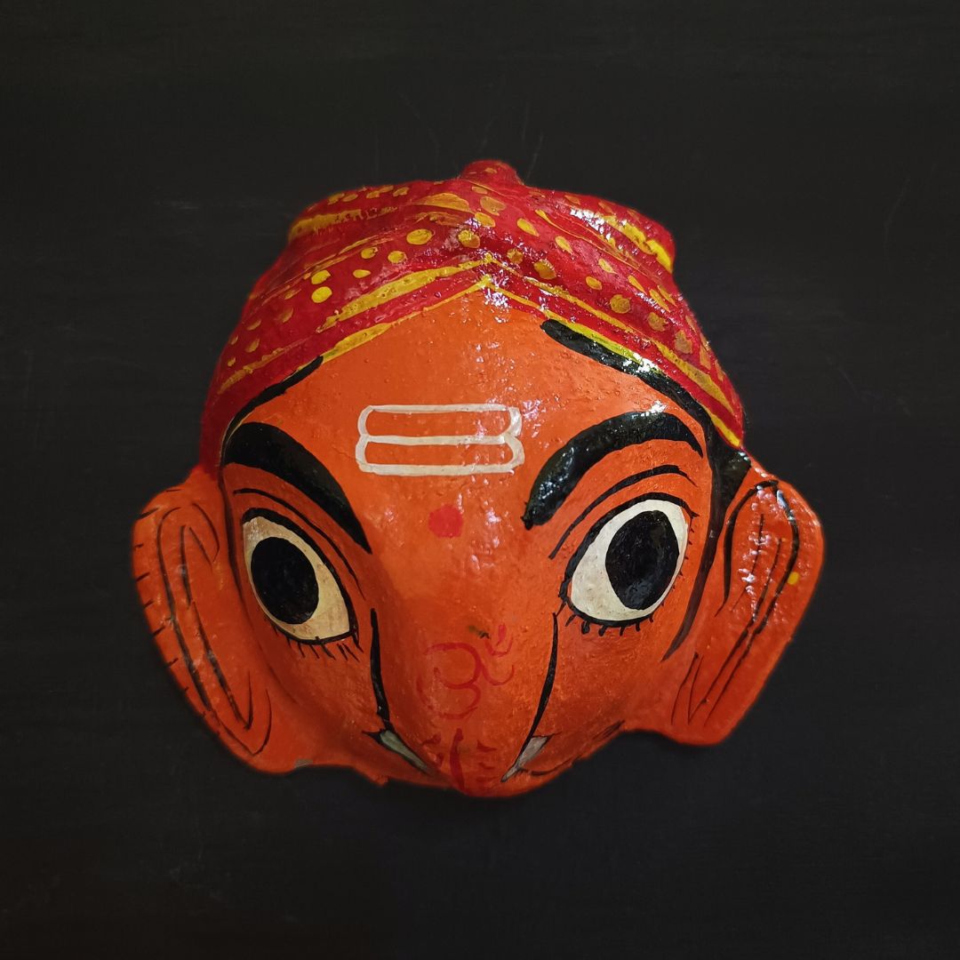 small cheriyal mask of cute ganesh in orange color