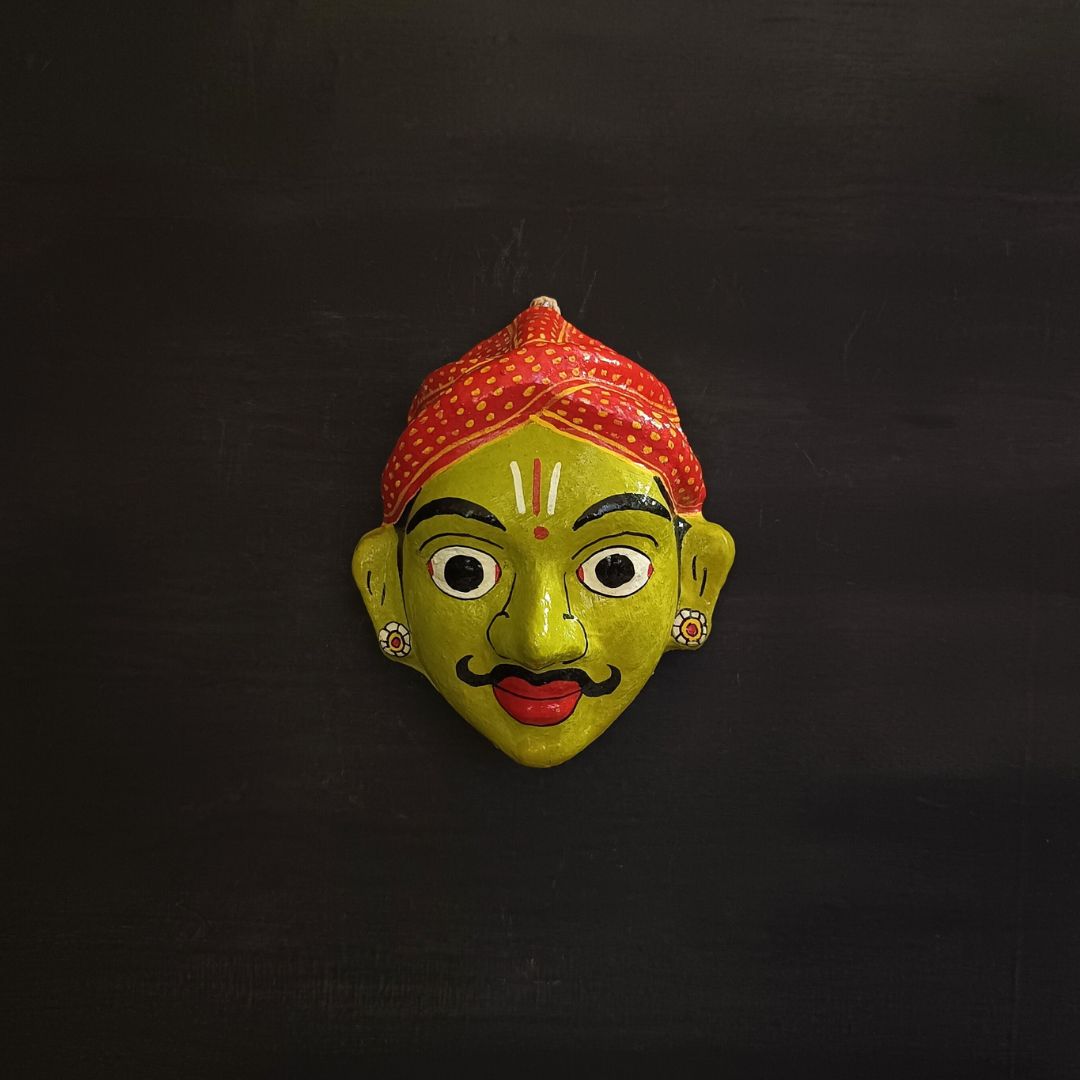 classic male cheriyal mask with green color face wearing red turban