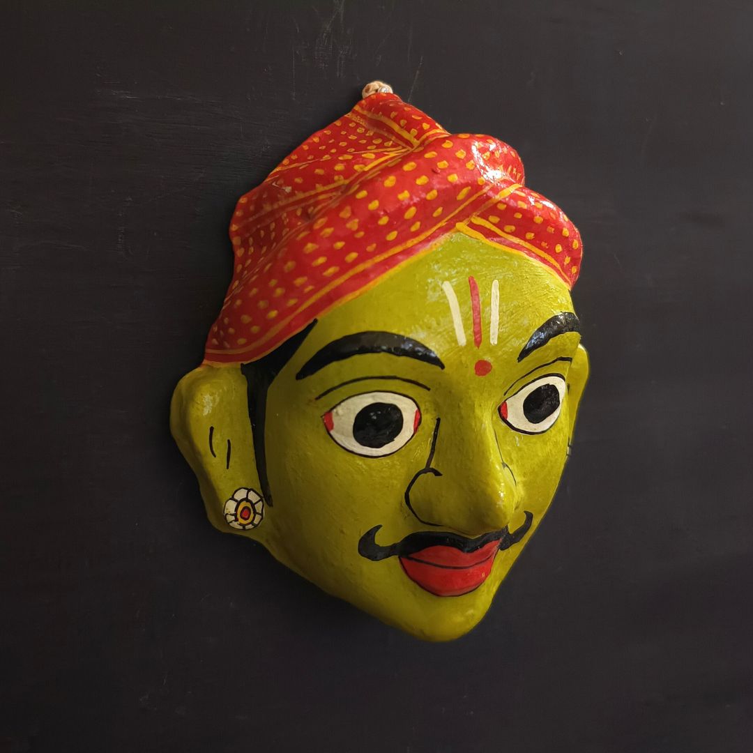 classic male cheriyal mask with green color face wearing red turban