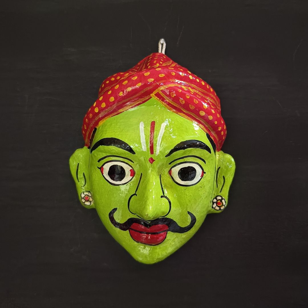 classic male cheriyal mask with light green color face wearing red turban