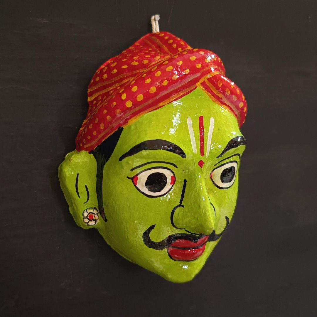 classic male cheriyal mask with light green color face wearing red turban