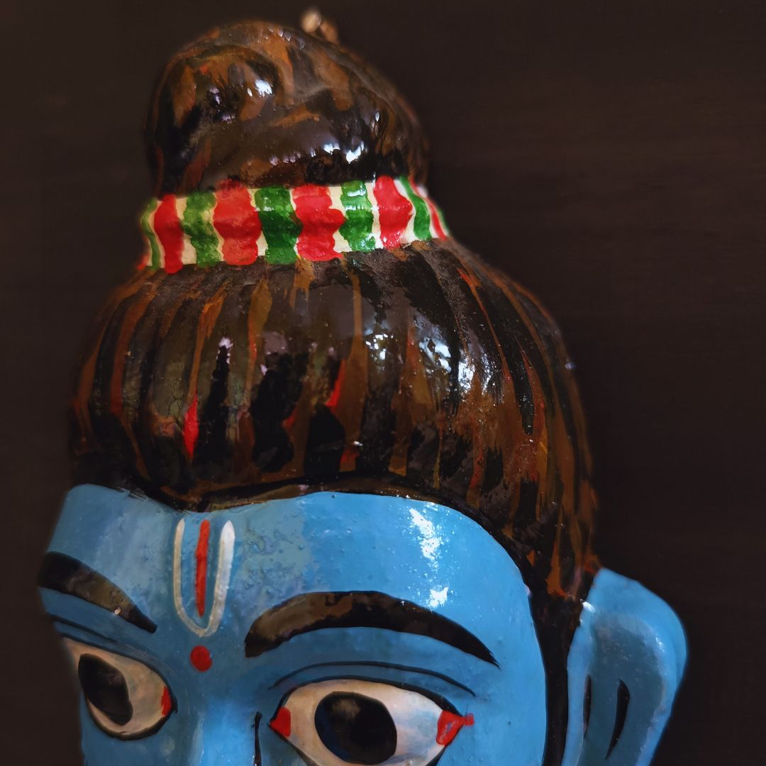 cheriyal mask of lord ram while in vanvas smiling and made in blue color
