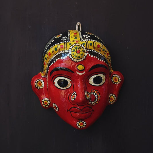 classic female cheriyal mask with red color face wearing ornaments