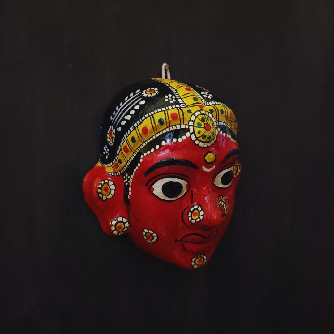 classic female cheriyal mask with red color face wearing ornaments