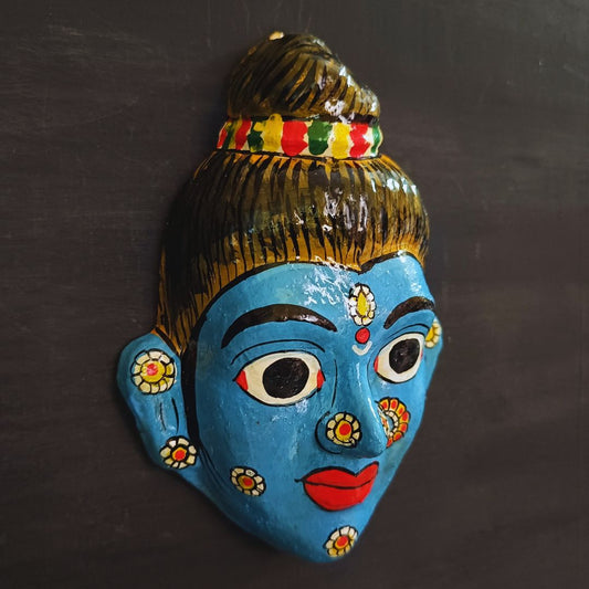 cheriyal mask of sita devi while in vanvas smiling and made in blue color showing side view