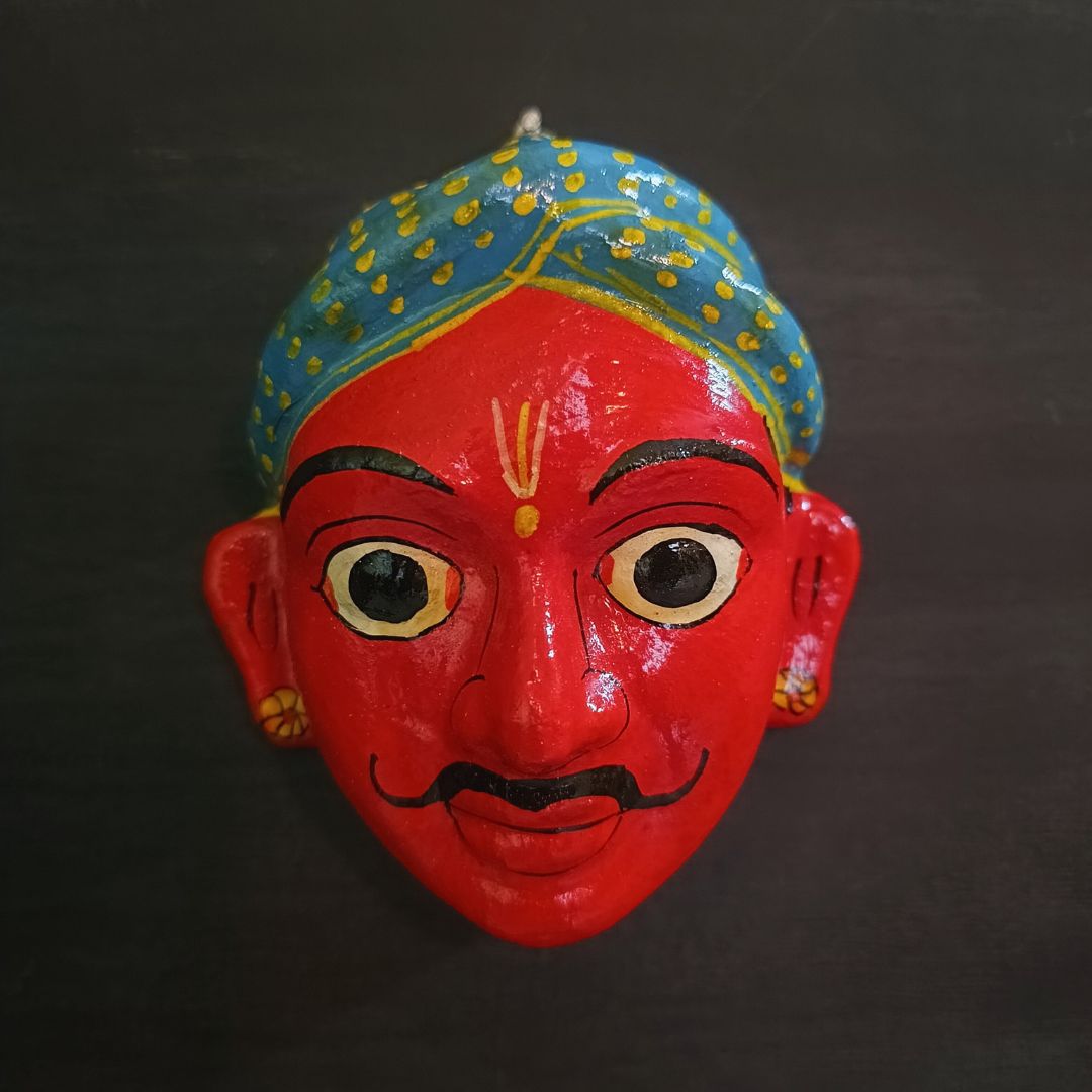 classic male cheriyal mask with red color face wearing blue turban