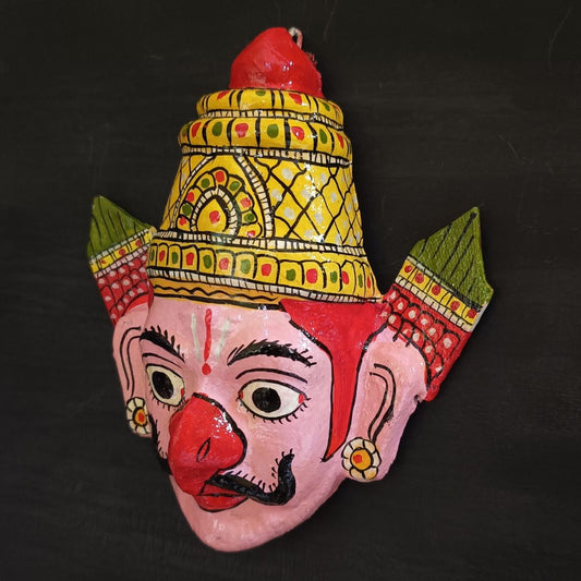 crowned garuda cheriyal mask in light pink color face with traditional and vintage look