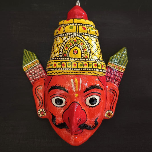 crowned garuda cheriyal mask in orange color face with traditional and vintage look