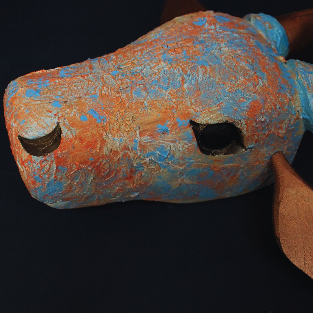 unique hand painted wooden cow head painted with crackle paste and applied colors on top