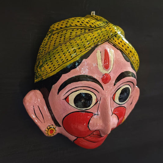 classic hanuman cheriyal mask with light pink color face wearing light green turban