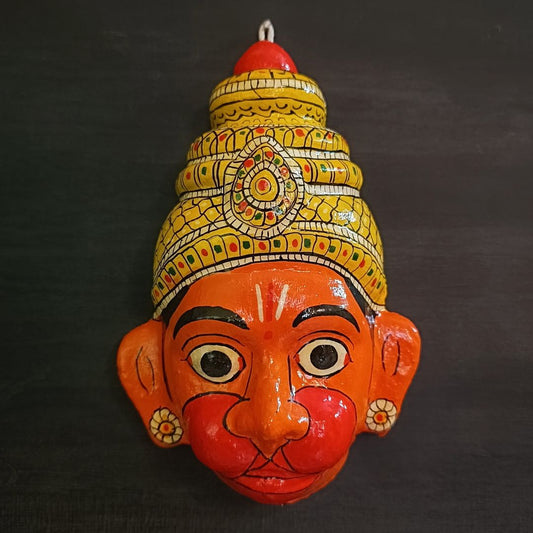 crowned hanuman cheriyal mask in orange face color with traditional and vintage look