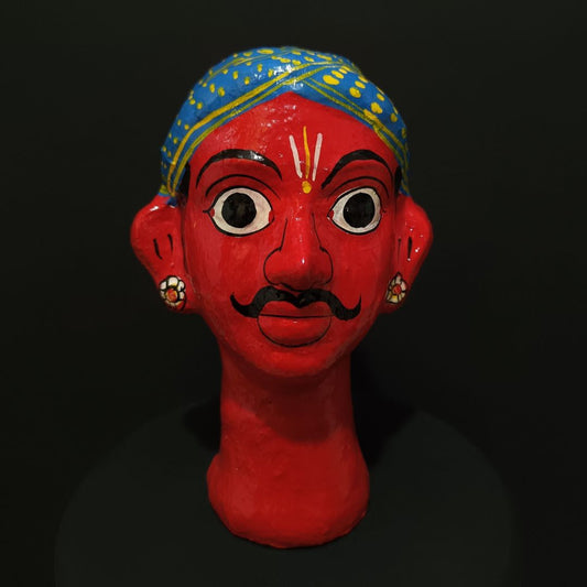 red color male cheriyal stand mask for table decor