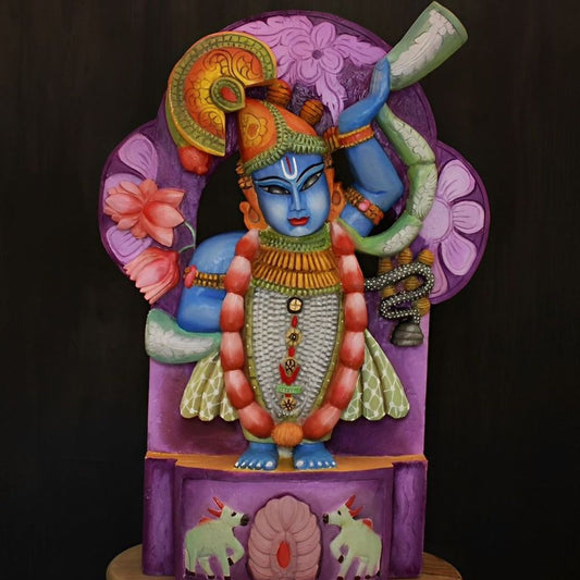 hand crafted wooden artifact of lord srinath ji in blue color with as smiling face and serene looks
